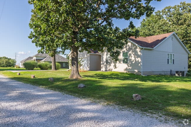 Newer homes line a gravel road outside Montreal.