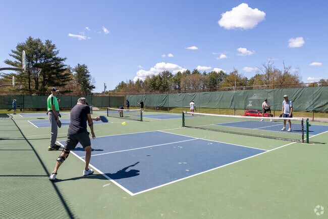 Local residents of Gorham enjoy the day playing pickleball.