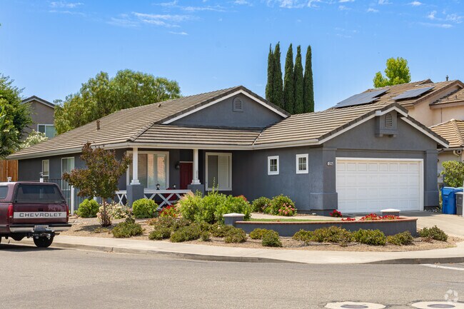 A ranch-style home in Islay sits on a corner lot with many succulents.