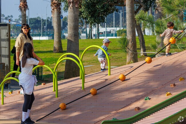 Kids can play at the playground on Alamitos Beach.