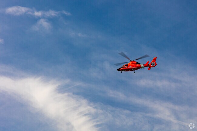 Emergency helicopters are nearby in the sky with AtlanticCare nearby.