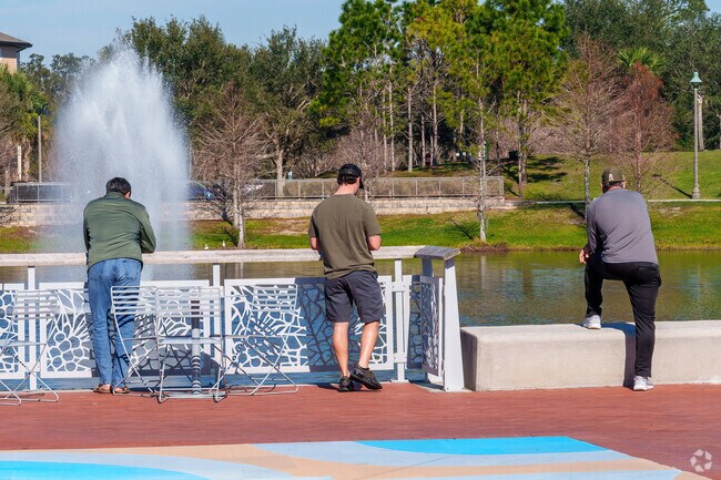On a beautiful day, Oviedo residents savor the serene fountain at Center Lake Park.