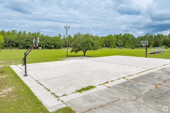 Students enjoy outdoor play on the sports courts at Saint John Paul II Catholic School.