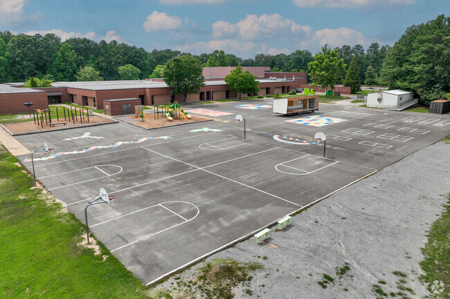 Evergreen Elementary School offers multiple basketball courts for students to play on.