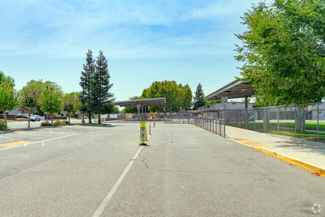 Shade is provided for students of Kynoch Elementary School waiting for a ride.
