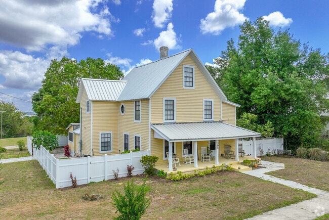 A refurbished historic Clermont home features an amazing front porch for relaxation.