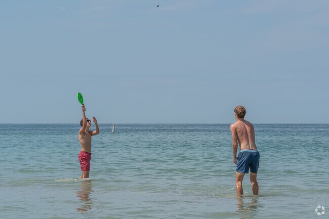 Calm waters at Belleair Beach offer a safe spot for families to swim and play.