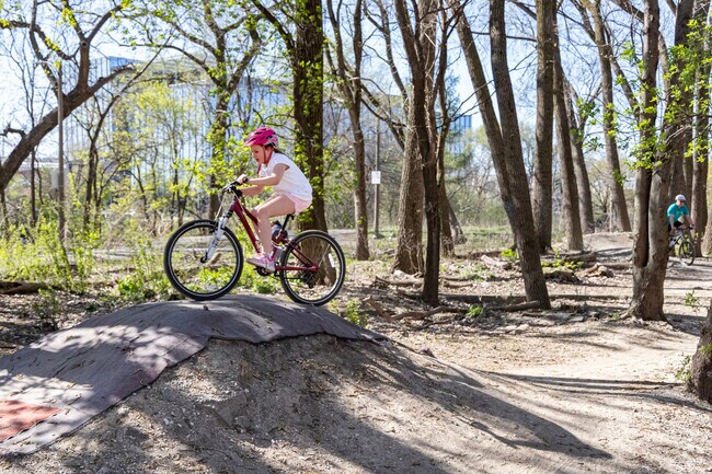 Roscoe Village kids get a thrill at The Garden's dirt bmx jumps behind Lane Tech.