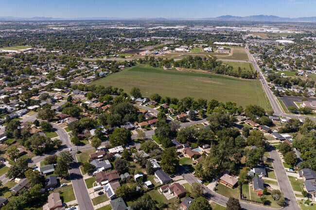 An aerial view shows this homes peppered throughout green space.