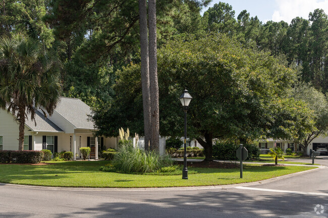Tall pines and palms surround the homes in Woodbridge.