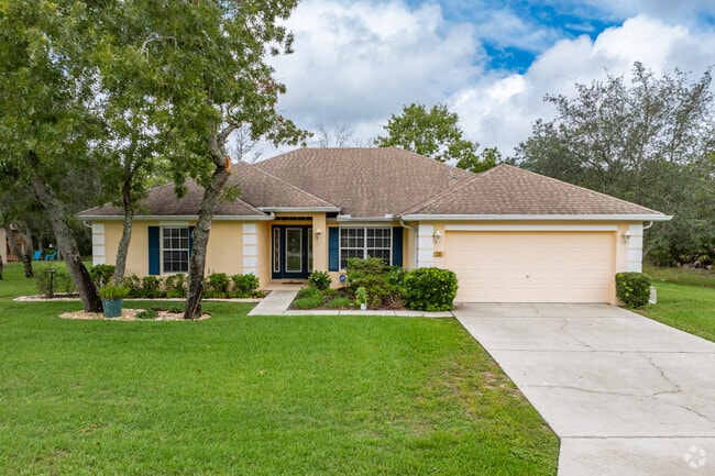 Homes have beautiful shade trees front and back in Cypress Village at Sugarmill Woods.