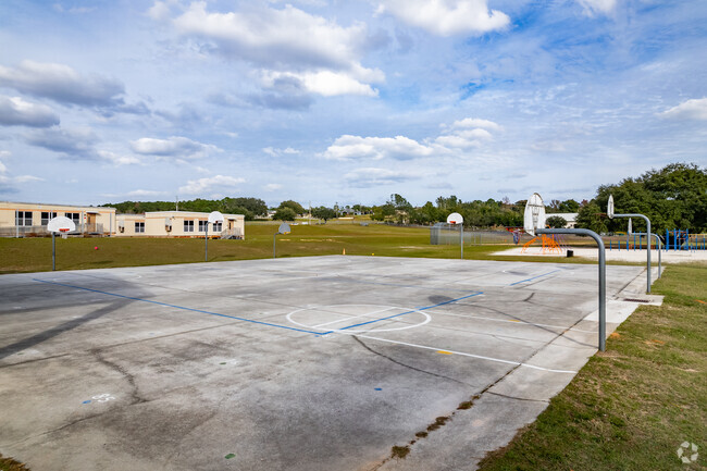 Kids love to play hoops on the basketball court at  Lost Lake Elementary School.