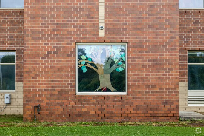 Students work on crafts like this paper tree at Joseph Osgood Elementary School in Cohasset.