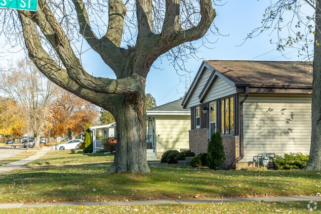 There are many mature trees covering the homes in the Stocker neighborhood.