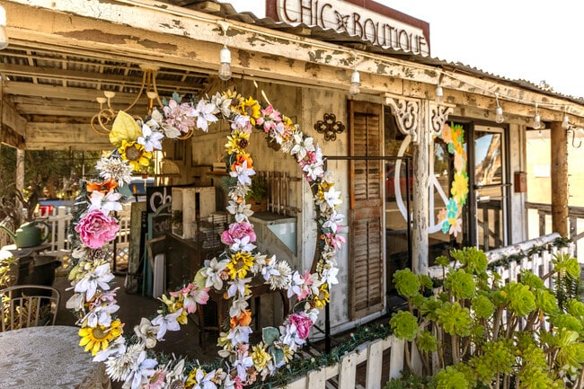 Alpine Neighborhood Chic Boutique peace sign made of flowers.