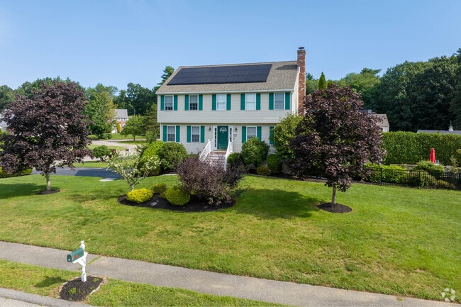 Solar panels can be seen on this colonial style home in Tewksbury.