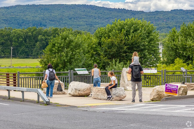Families stroll to parks, cafés, and the Rail Trail downtown.