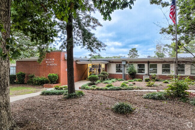 The flag for the Calvin Wiley Elementary School is at the front entrance.