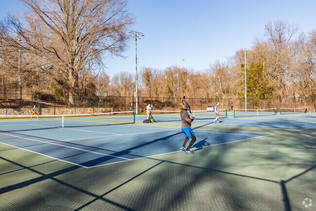 Locals gather to serve up fun and competition at Vienna's Nottoway Park tennis courts.