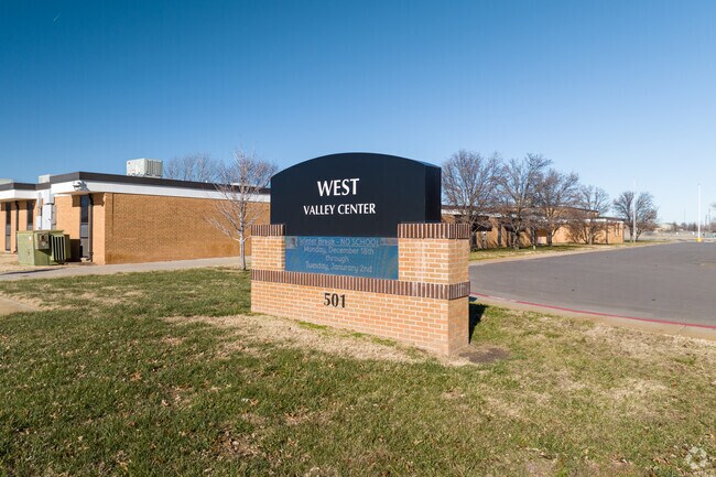 West Elementary School has a large stone sign.