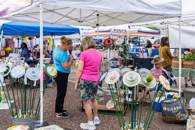 Local artists display yard art at Telford Night Market.