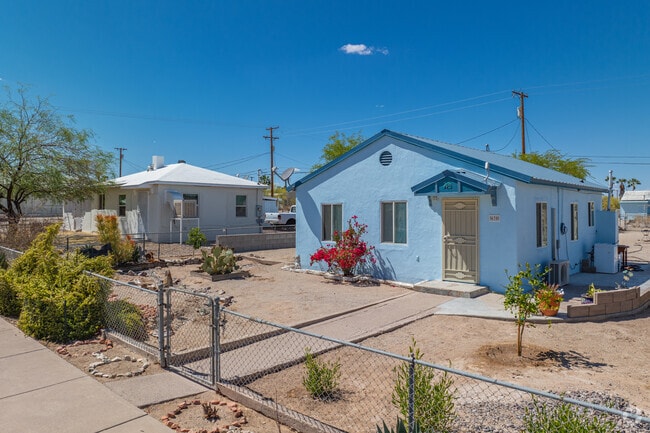 Modest single-story homes in Ajo are often surrounded by drought-tolerant plants and gravel landscaping.