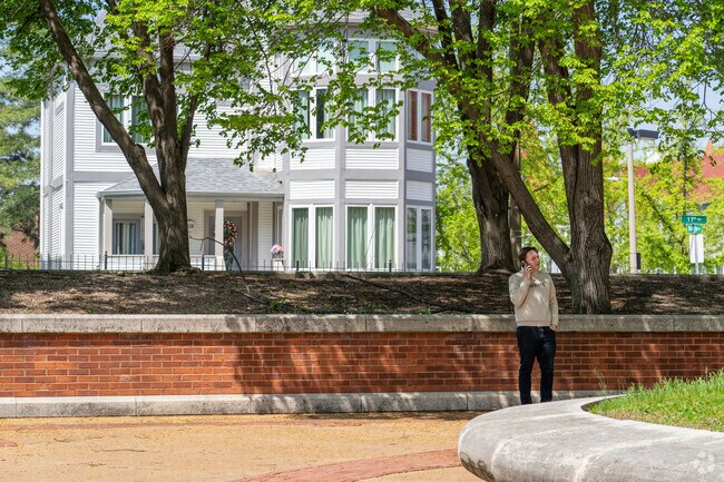 Enjoy the walled off courtyard of Columbus Square Park.
