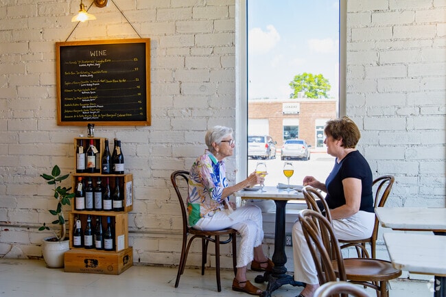 Ashland friends enjoy a glass of wine at Fariner Bakery.