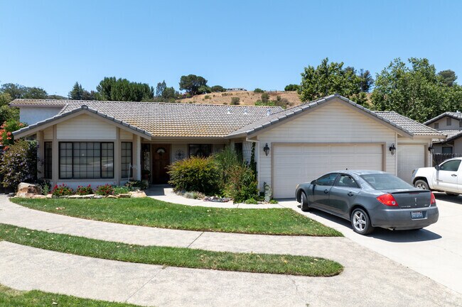 This Pine Canyon ranch-style home features a tile roof and welcoming curb appeal.