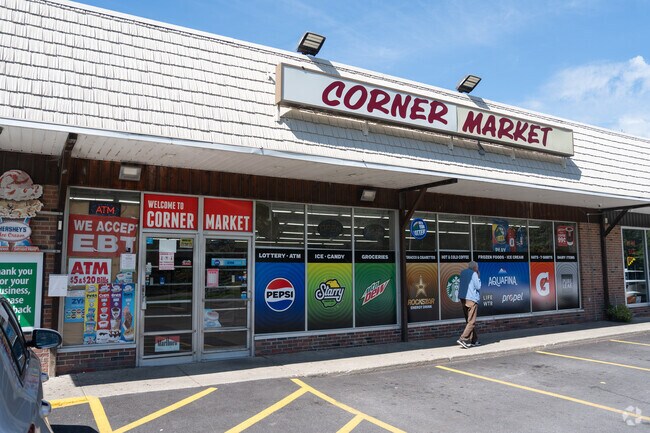 Sweet Home Corner Market on Sweet Home Road is located next to Favorites Pizza & Wings.