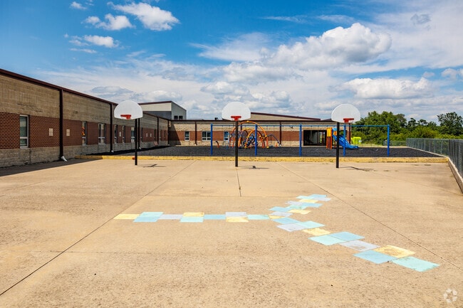 Primary School students have access to a variety of outdoor play equipment at recess.