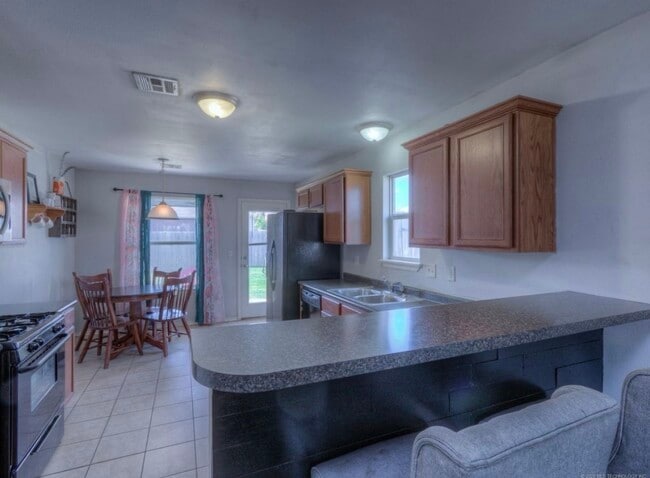 Stone has been added where the black painted wood is.