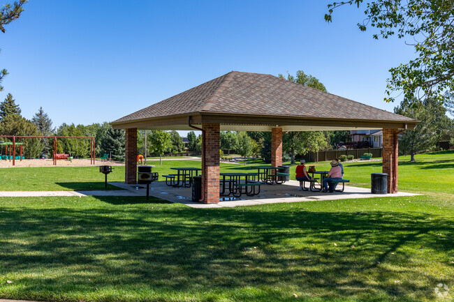 Park View Community Pool and Park has a shaded picnic area, a pool, and a playground.