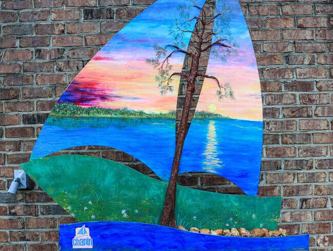 Artists make their mark in Chapin by charming boat shaped sculptures throughout the town.