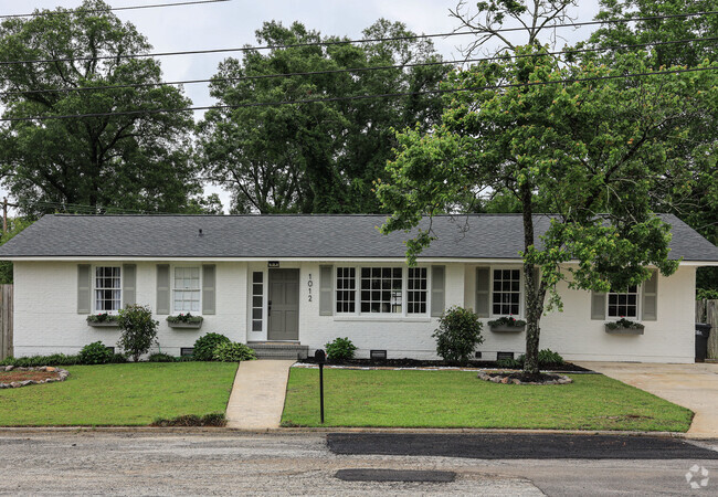 White brick ranch located at the end of a street in the Lakemont neighborhood of Augusta, GA.