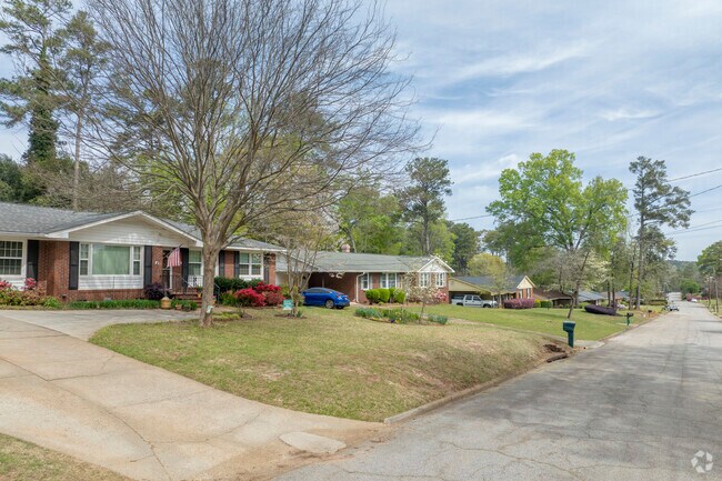 Many homes in National Hills neighborhood constructed with traditional brick exteriors.