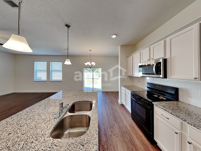 4615 Reisswood Loop, Palmetto, FL 34221 - photo 3