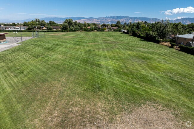 Academy Park Elementary has a large multi use field with mountain views.