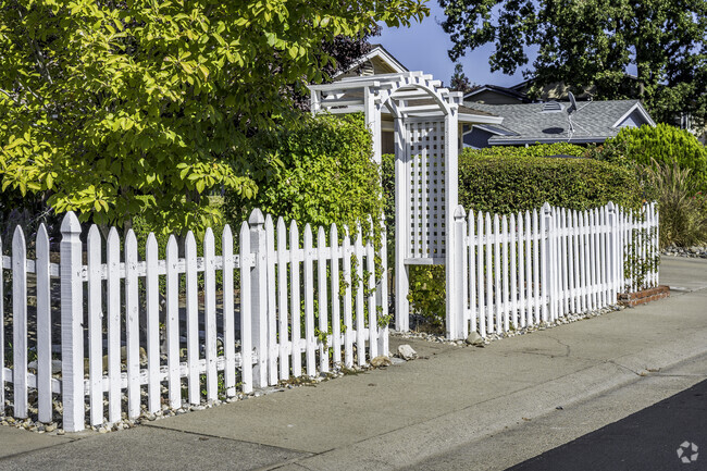 Some homes in Foothill Junction have picket fences with arched entries.