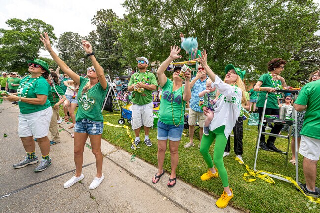 Catch a stuffed animal at the St. Patrick's Day Metairie Road Parade.