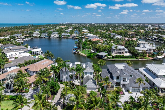 Aqualane Shores is an affluent community with large waterfront homes and direct beach access.