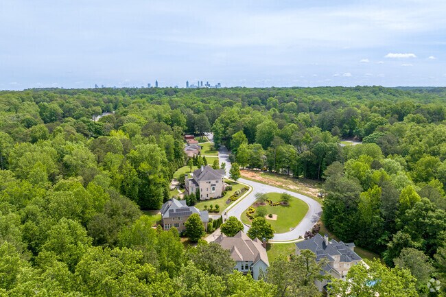 Peyton Forest features peaceful winding streets framed by mature trees and spacious homes.