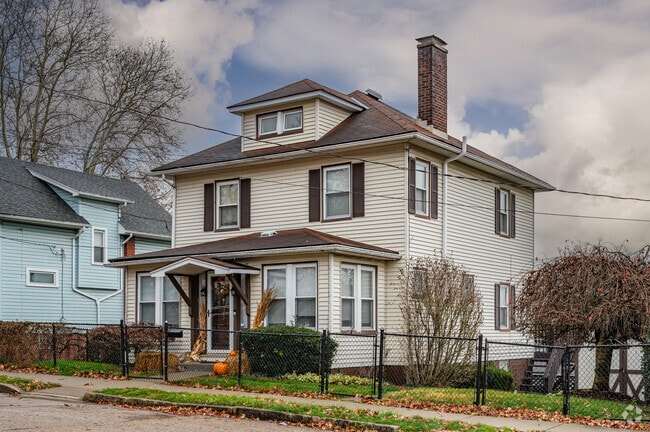 A classic American Foursquare sits on a good sized lot on a side street of Washington.