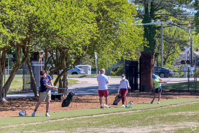 Golfers perfecting their swings at Sewells Point Golf Course near the Wards Corner neighborhood of Norfolk Virginia.