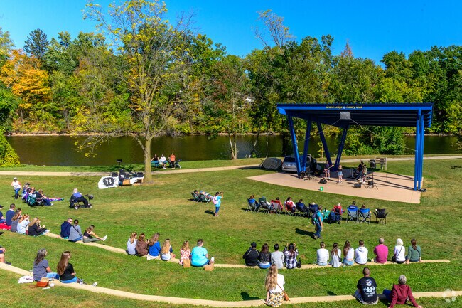 Community members enjoy live music at the Rotory bandstand at the Grand Ledge Fall Festival.