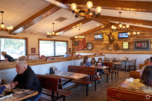 Enjoy a southern style BBQ sandwich at Moonswiners' rustic setting in Fort Pierce South.