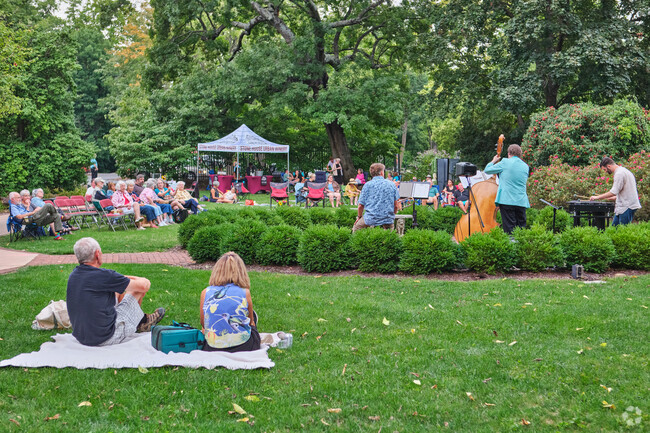 Residents enjoy an event in the rose garden at the Fine Arts Museum in Hagerstown.