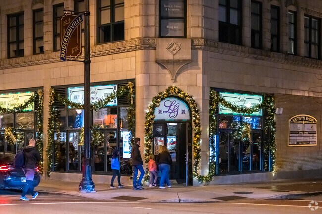A family heads into a restaurant during the Shop and Dine Fridays event in Andersonville.