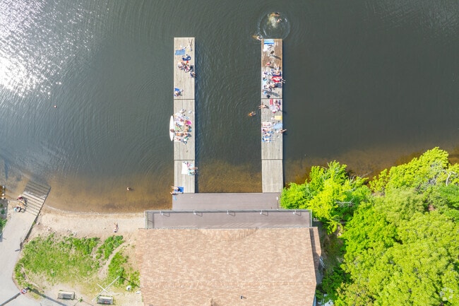 Residents of Symmes Corner can hang on the dock at Upper Mystic Lake on a hot and sunny day.