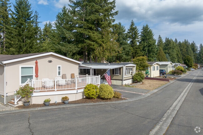 Mobile homes tucked into Bear Creek’s forest offer a quiet, nature-filled retreat.